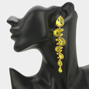 Yellow long teardrop stone cluster drop evening earrings on gold on a black mannequin ear