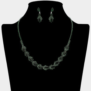 Emerald Green marquise crystal necklace set on silver-tone settings, with a slim line of small crystals leading to leaf-shaped marquise stones edged in tiny crystals and matching drop earrings. The necklace measures 16 inches plus a 4-inch extender, with 0.4-inch decor; earrings are 0.9 inches long. Displayed on a black necklace bust against a light gray background.