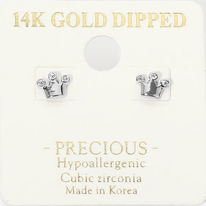 Tiny silver-tone crown stud earrings with clear cubic zirconia accents at the crown tips and a polished metal base. Each earring measures approximately 0.25 by 0.2 inches. Mounted on a cream jewelry display card with gold lettering against a white background.