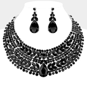 Black crystal statement necklace set on silver-tone metal, featuring a broad, layered bib of marquise and round stones with a large teardrop centerpiece and matching teardrop earrings. Necklace measures 17 inches plus a 2-inch extender, with 2.25-inch decor; earrings are 2.2 inches long. Displayed on a white jewelry bust against a white background.