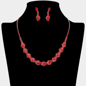 Red crystal marquise necklace set on silver-tone settings, with a slim line of small crystals leading to leaf-shaped marquise stones edged in tiny crystals and matching drop earrings. The necklace measures 16 inches plus a 4-inch extender, with 0.4-inch decor; earrings are 0.9 inches long. Displayed on a black necklace bust against a light gray background.