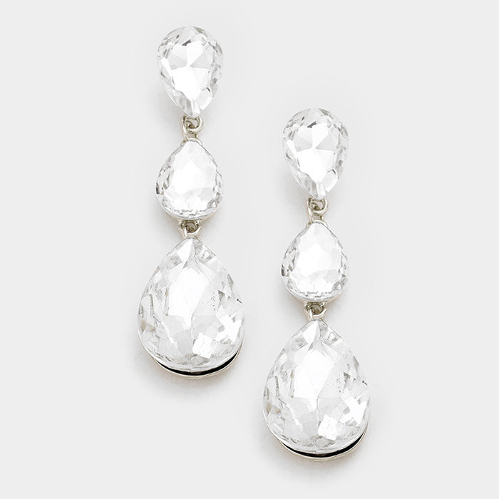 A pair of clear on silver triple teardrop earrings with post back closure on a white background.