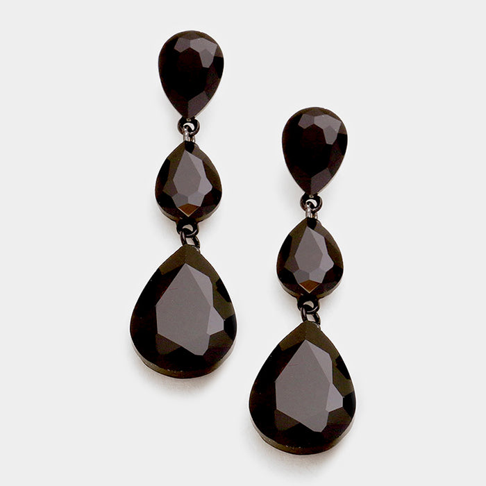 A pair of black triple teardrop earrings set on black metal with post back closure, displayed against a white background.