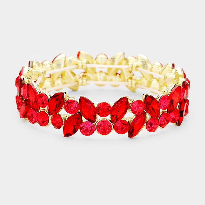 Red crystal marquise stretch bracelet on gold setting on a white background