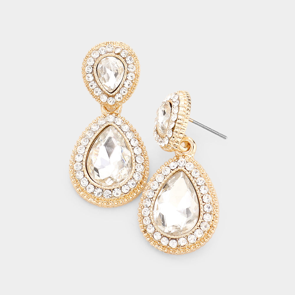 Small clear double teardrop crystal earrings on gold with rhinestones on white background