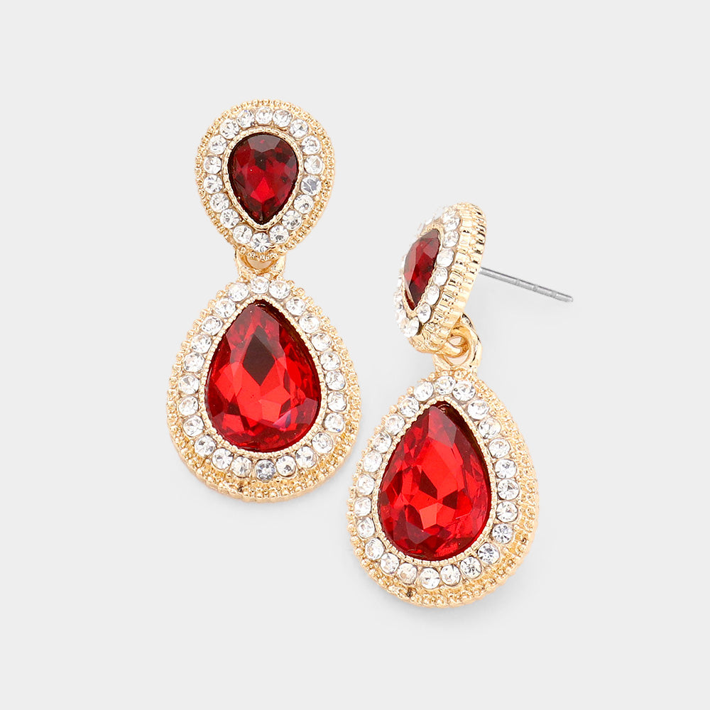 Small red double teardrop crystal earrings on gold with clear rhinestones on white background