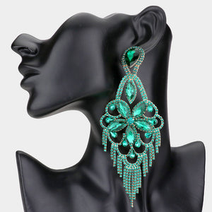 Very large emerald green crystal flower fringe pageant earrings on gold with 5.5 inch drop shown on a black mannequin ear